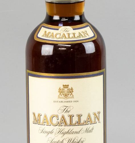 Null A bottle of single malt whiskey, Macallan 18 years old Distilled in 1982, b&hellip;