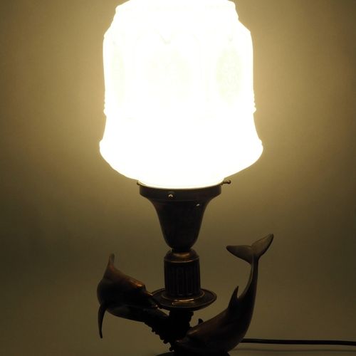 Large figure table lamp, early 20th century. 大型人物台灯，20世纪初。

以灯塔的形式。灯座由深绿色大理石制成，有&hellip;