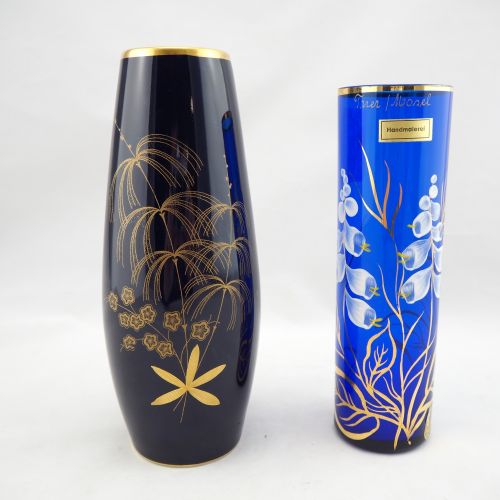 Two Vases Two vases

Glass blue colored, with enamel and gold. Cold painting. H.&hellip;