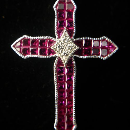 Null AN 18CT WHITE GOLD, DIAMOND AND RUBY CROSS

Boxed.

(approx rubies 3.33ct, &hellip;