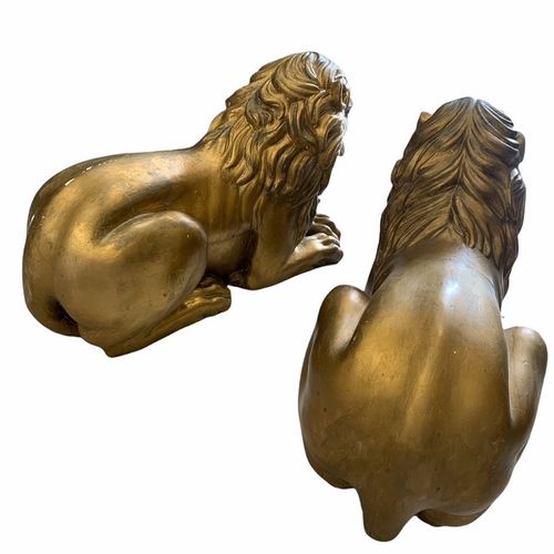 Null A LARGE PAIR OF DECORATIVE 19TH CENTURY CARVED GILTWOOD RECUMBENT LIONS.

(&hellip;