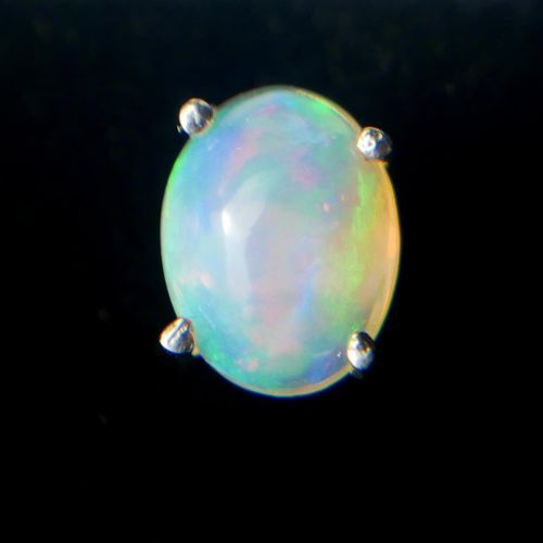 Null A PAIR OF ETHIOPIAN OPAL AND SILVER STUDS.