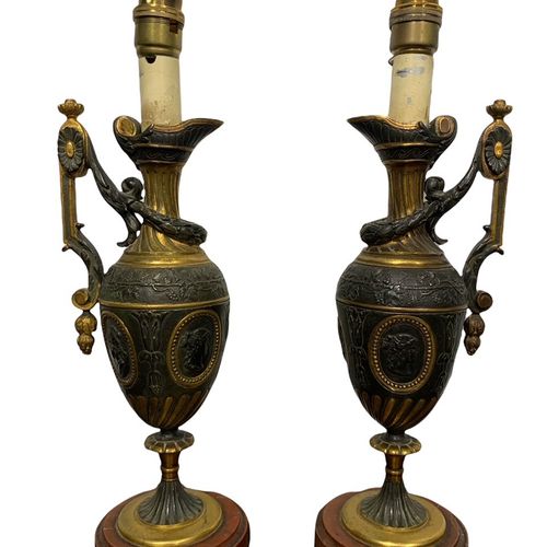 Null 
A PAIR OF 19TH CENTURY GRAND TOUR BRONZE AND GILT BRONZE EWERS

decorated &hellip;