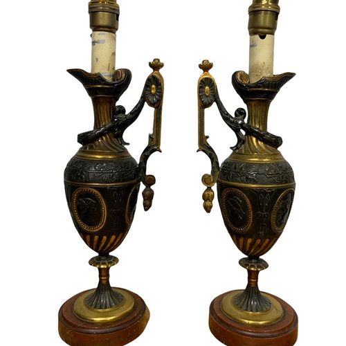 Null 
A PAIR OF 19TH CENTURY GRAND TOUR BRONZE AND GILT BRONZE EWERS

decorated &hellip;