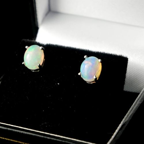 Null A PAIR OF ETHIOPIAN OPAL AND SILVER STUDS.