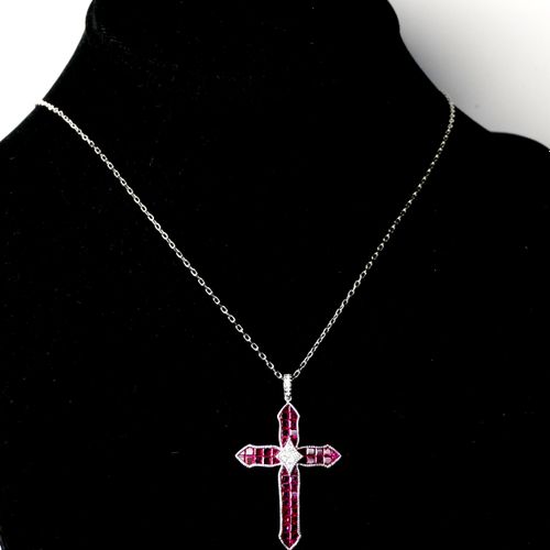 Null AN 18CT WHITE GOLD, DIAMOND AND RUBY CROSS

Boxed.

(approx rubies 3.33ct, &hellip;