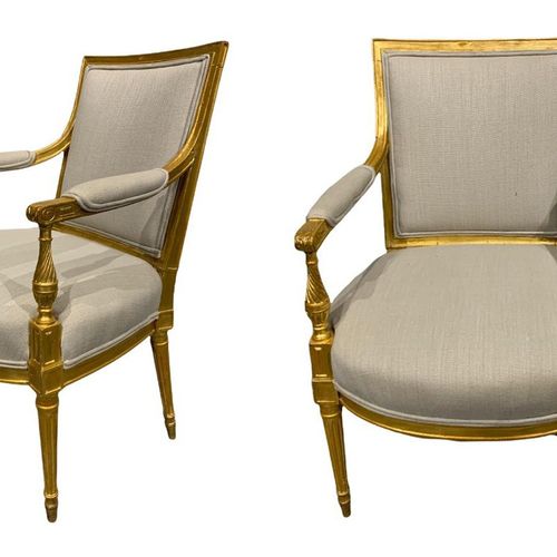 Null A PAIR OF GEORGE III CARVED GILTWOOD ARMCHAIRS

The padded arms terminating&hellip;