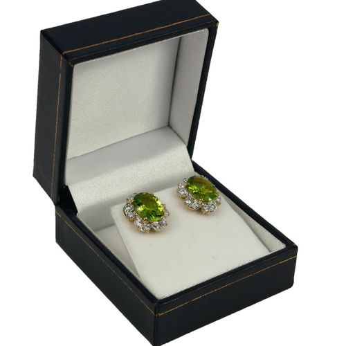 Null A PAIR OF YELLOW GOLD OVAL PERIDOT AND DIAMOND CLUSTER EARRINGS,Boxed.

(Ap&hellip;