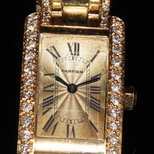 Null A lady's 18ct gold and diamond Cartier watch, champagne dial with Roman num&hellip;
