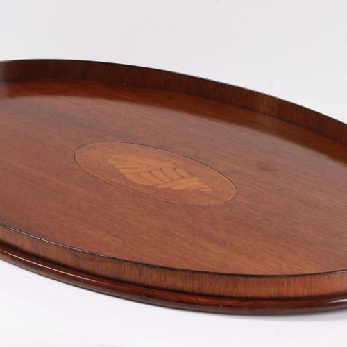 Null Tray. England, after 1900, oval mahogany tray with brass handles. L: 55 cm.