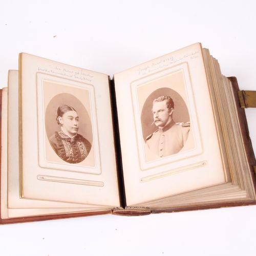 Null Two photo albums. After 1900, leather binding with brass fittings. Damage.