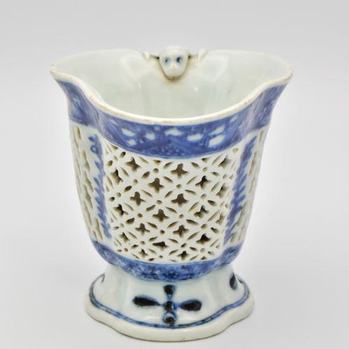 ? A CHINESE BLUE AND WHITE PORCELAIN RETICULATED LIBATION CUP, QIANLONG PERIOD, &hellip;