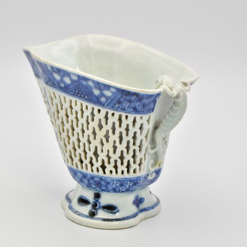 ? A CHINESE BLUE AND WHITE PORCELAIN RETICULATED LIBATION CUP, QIANLONG PERIOD, &hellip;