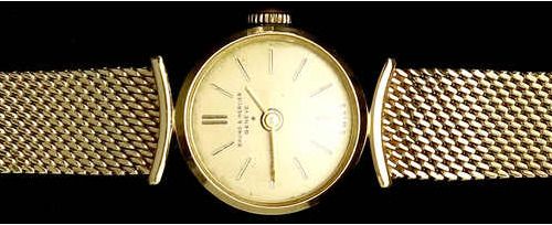 Null 金表--腕表 ----- 钟表 
BAUME & MERCIER 黄金750/1000女士腕表，带ESZEHA手镯。长13.5厘米，边框16毫米。手动&hellip;