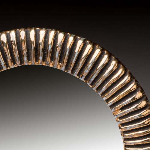Mithé ESPELT (1923-2020) 
Circular mirror 
Gilded ceramic with fine gadroons. 
A&hellip;