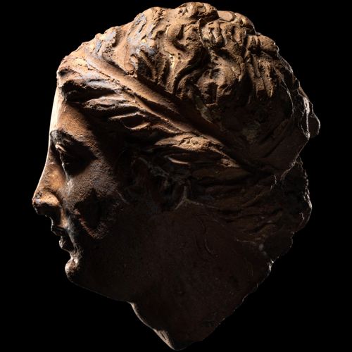 Null A Greek Terracotta Female Head

Height 1 9/16 inches (4 cm).