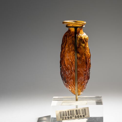 Null A Roman Amber Glass Date Flask¬†

Height 3 inches (8 cm).