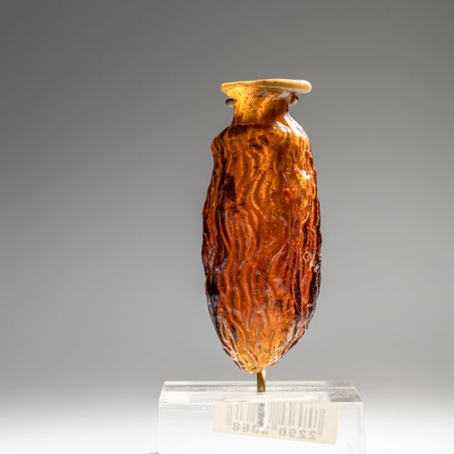 Null Fiaschetta romana da dattero in vetro ambrato¬†

Altezza 8 cm.