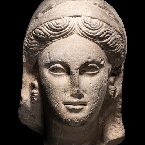 Null A Greek Limestone Head of a Woman

Height 13 inches (33 cm).