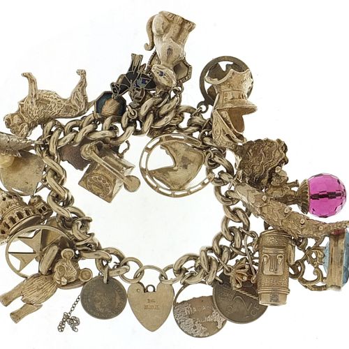 Null Heavy silver charm bracelet with a selection of mostly silver charms includ&hellip;