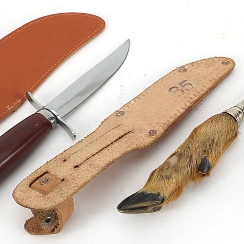 Null Three hunting knives with leather sheaths including one with deer foot hand&hellip;