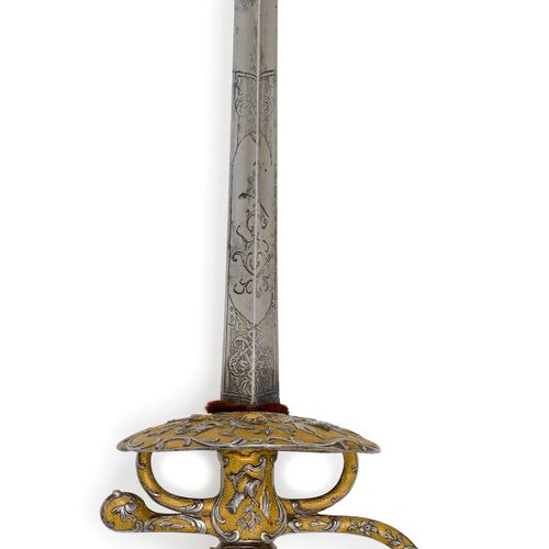 Null GALADEGEN
法国，约1750年，为一个官员。
铁制剑柄，由铸造和锻造部分组成，球形鞍座，铆钉头，握弓结束于握柄底座，短轴，两个握钩，护手由肾形&hellip;