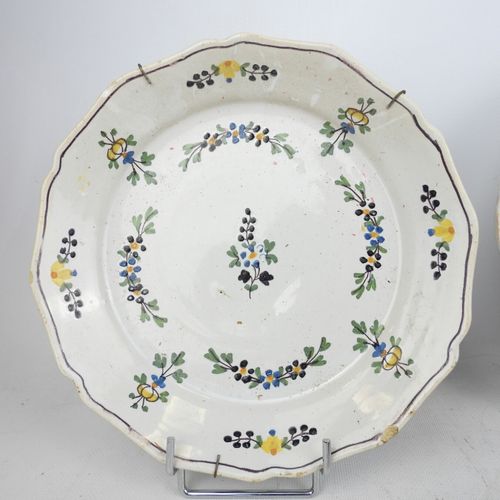 Null FOUR earthenware plates enameled with polychrome flowers. 19th century. Dia&hellip;