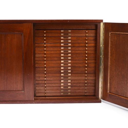 Null A mahogany coin collector's cabinet, two doors enclosing a total of forty s&hellip;