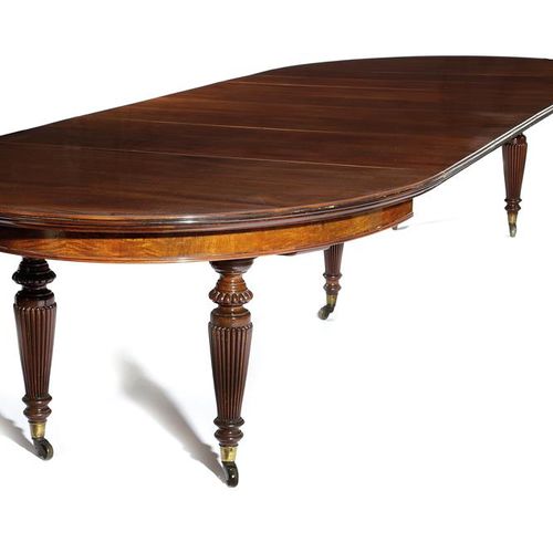 Null 一张维多利亚时期的红木餐桌，约1870-80年，桌面上有一个圆弧形的边缘，延伸出一个发条，可以容纳五个额外的叶子，有五个浅裂的和带肋的锥形腿，有一个叶&hellip;