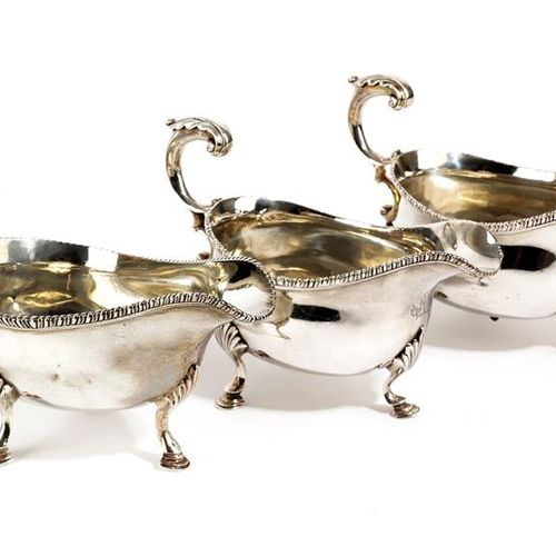 Null A PAIR OF VICTORIAN SILVER SAUCE BOATS AND A GEORGE III SILVER SAUCE BOAT B&hellip;