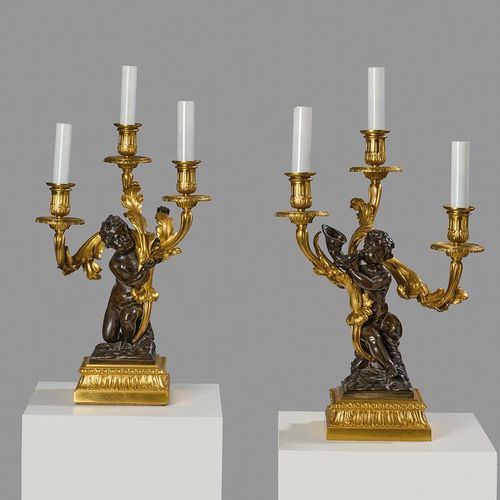 Null A PAIR OF FRENCH ORMOLU AND PATINATED BRONZE FIGURAL CANDELABRA AFTER THE M&hellip;