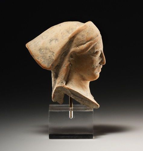 A Head of a Woman Western Greek mid-5th cent. B.C..

Terracotta. H. 8 cm. W. 7.5&hellip;