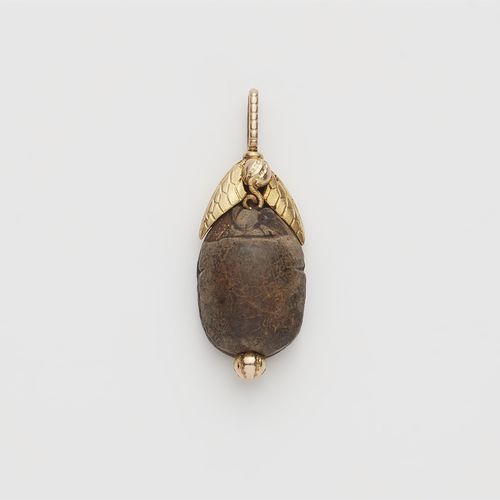 Null Pendant with antique scarab

14 ct yellow gold. Scarab made of carved steat&hellip;