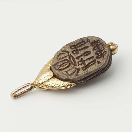 Null Pendant with antique scarab

14 ct yellow gold. Scarab made of carved steat&hellip;