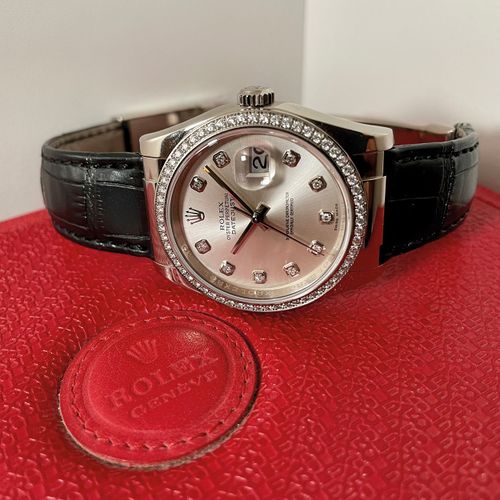 Rolex (*) A very attractive diamond-set wristwatch with date and original box

M&hellip;