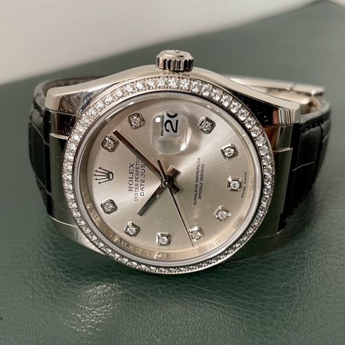 Rolex (*) A very attractive diamond-set wristwatch with date and original box

M&hellip;