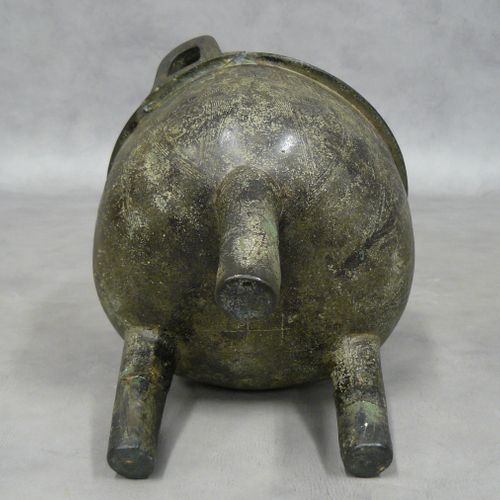 China: tripod bronze ritual vase of ding shape, used for cooking food. The body &hellip;
