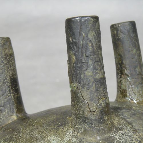 China: tripod bronze ritual vase of ding shape, used for cooking food. The body &hellip;