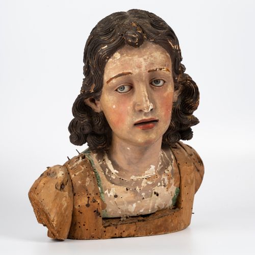 Null 天使的头颅，卷曲的头发和硫磺制成的自然眼睛。

意大利。

 那不勒斯。18世纪末-19世纪初。高

(明显的重音、空隙)。

附有一个橡木控制台。高&hellip;
