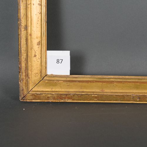 Baguette en bois mouluré et doré. Époque Louis XVI (éclats). 33,8 x 70,8 cm Prof&hellip;