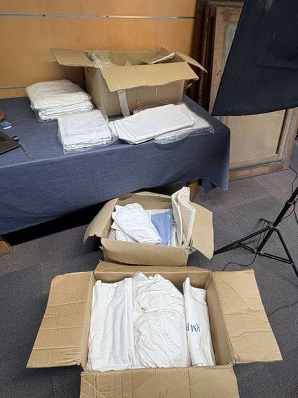 A set of household linens, including embroidered i