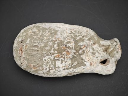 Petit vase en terre cuite  à panse  aplatie .
Corp
