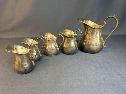Maison Brossier  set of 5 silver plated metal pitc