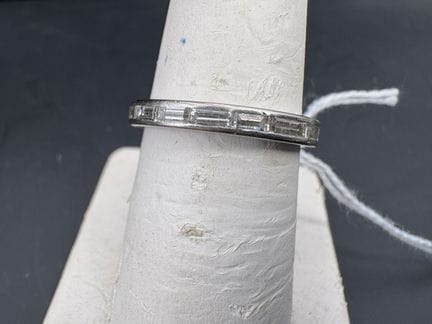 American wedding band, in white gold, set with 18 