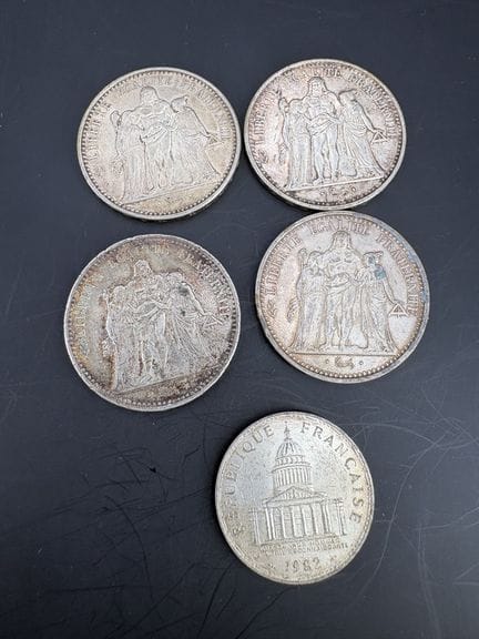 A set consisting of:
- Three 10-franc silver coins