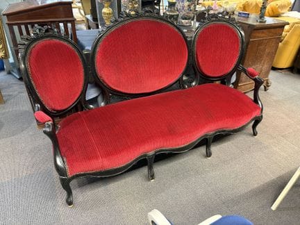 Bench, made of blackened wood and red velvet, from