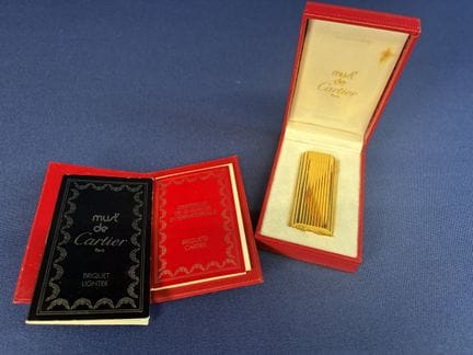 Must de Cartier, briquet en plaqué or, en boite d'
