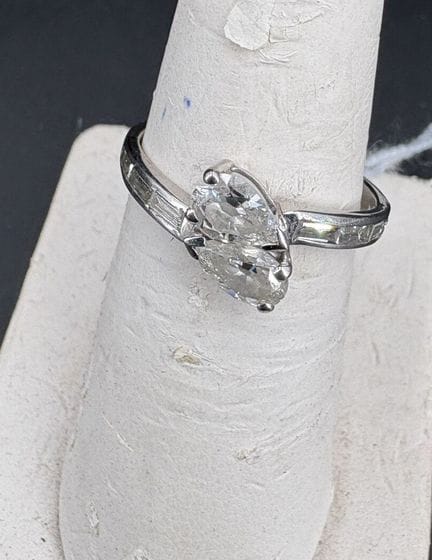 Ring, in white gold, set with two pear-shaped diam