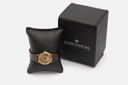 BAUME & MERCIER .Montre Dame en or jaune 18k (750 