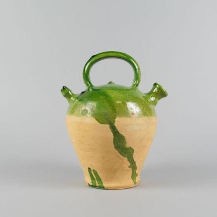 Terracotta jug, partially glazed green.
Height: ap